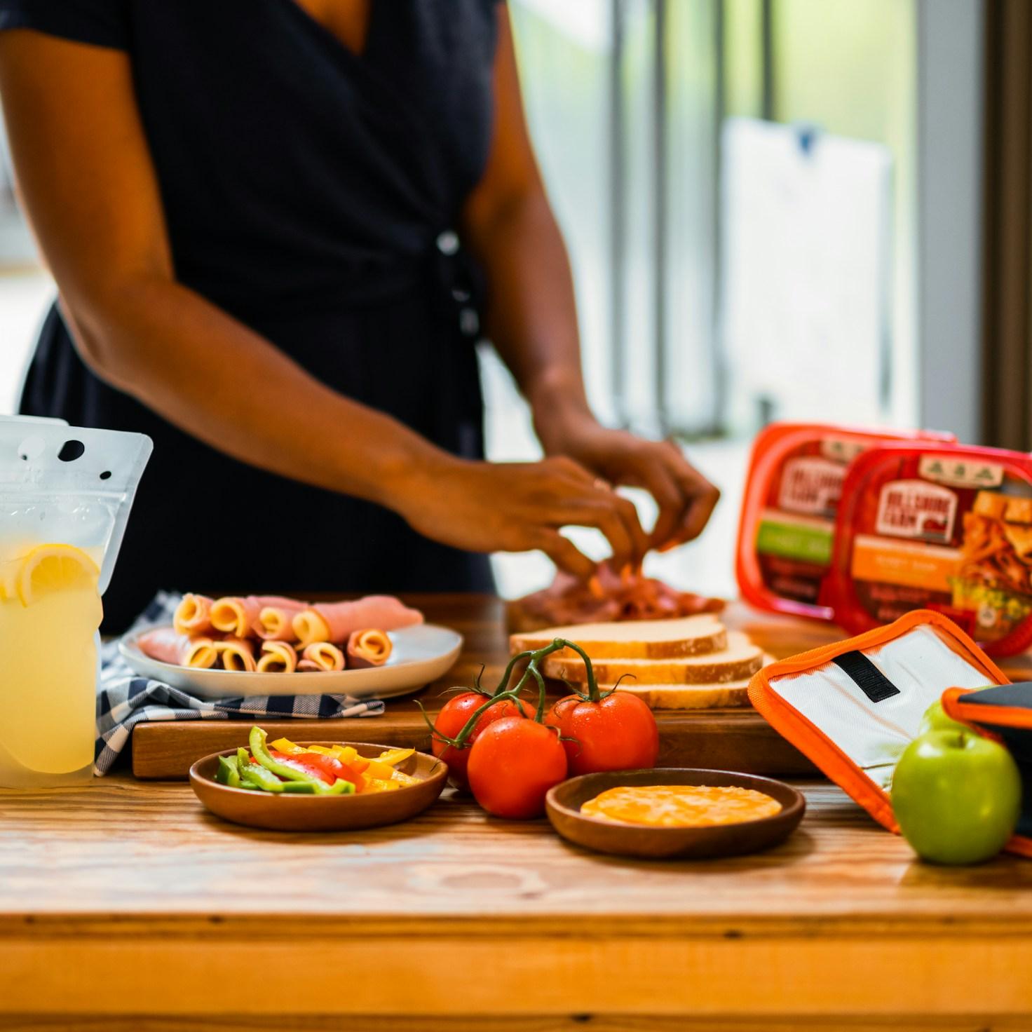 Community members collaborating in a modern kitchen space, sharing recipes and cooking techniques